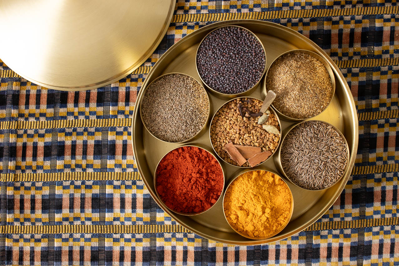 Brass masala dabba with spices